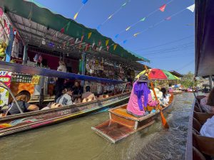 Bangkok, Thailand - November 12, 2024: Floating market with boats sell Thai food